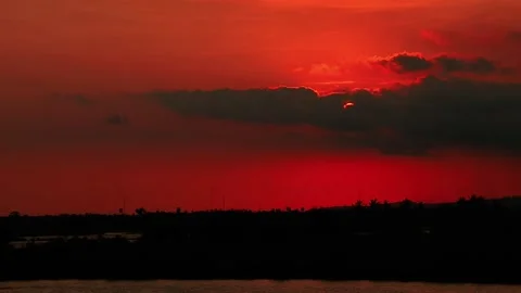 Flowing River Against Red Sunset Sky  Stock Footage 161773656