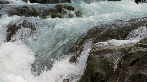 Flowing river burbles over rocks. Stock Footage 88342693