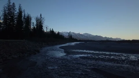 Flowing river with forest and landscape on either sides Stock Footage 104560424