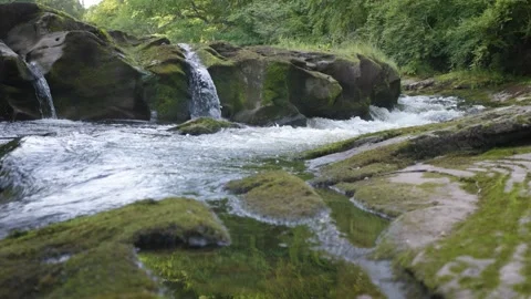 Flowing river that has created a number of small waterfalls. Stock Footage 158357859