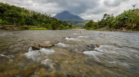 Flowing River With Mountain And Moving Cloud Pan Up Video stock 36449986