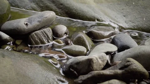 Flowing River Passing Through Small Rocks Video stock 78642692