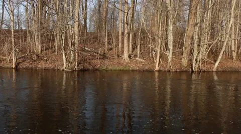 Flowing river in spring with flood water sunny day motion Stock Footage 48882854