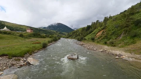 Flowing river stream through the mountains at Zeba village Stock Footage 283602023