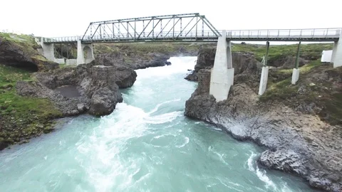Flowing river under metal bridge in Iceland Stock Footage 69741042