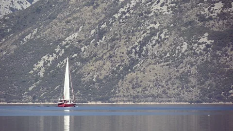 Flowing sailboat On The Background Of The Mountainside Stock Footage 98873394