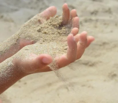 Flowing sand Stock Photos