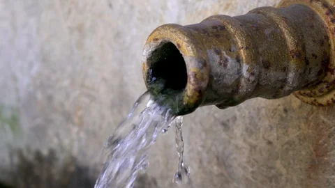 Flowing from the spout spring water Stock-Footage 88259965