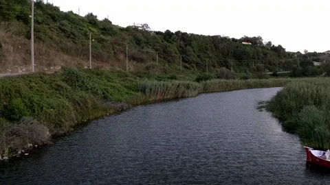 Flowing stream and road Stock Footage 167586070