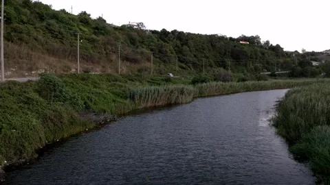 Flowing stream and road Stock Footage 167586306