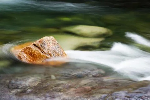 Flowing stream Stock Photos