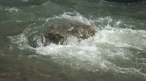 Flowing stream of river washes stone Stock-Footage 7740724