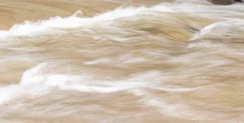 Flowing stream water for background. Stock Photos