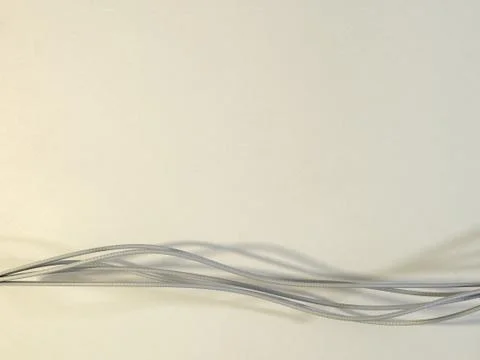 Flowing Strings or Ribbons on a warm textured background Stock Illustration