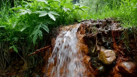 Flowing unprocessed thermal water Stock Footage 109525752