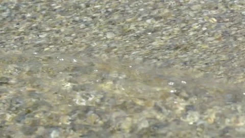 Flowing water and small pebbles on the floor Stock Footage 140515543