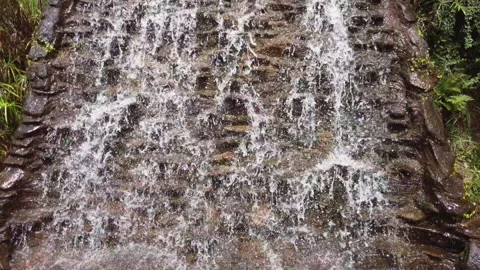 Flowing water In artificial waterfall Video stock 224624343