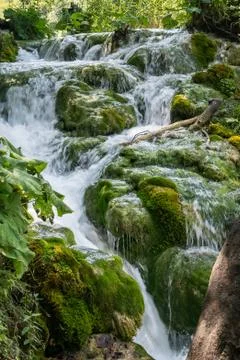 Flowing water between the rocks Stock Photos