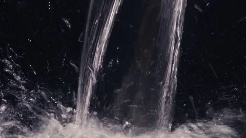 Flowing water on black background Video stock 73274140