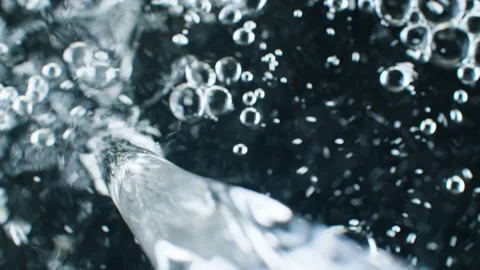 Flowing water on black background Stock Footage 135354975