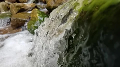 Flowing water in closeup slomotion Vídeos de archivo 238830308