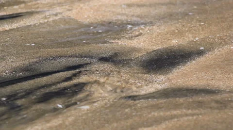 Flowing Water on Sand Bed Stock Footage 68989826