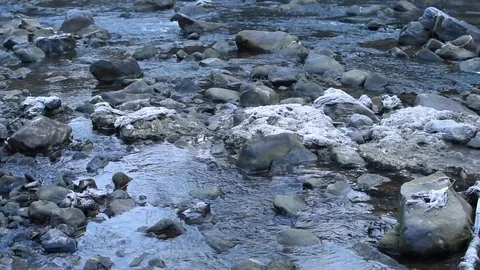 Flowing water of a small river between stones Stock Footage 123010448