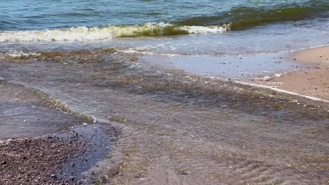 Flowing water in a small stream flows into Baltic Sea near Ystad Scania Sweden Stock Footage 241007940