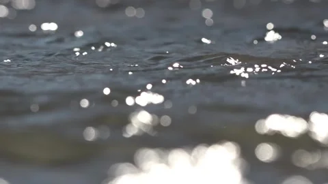 Flowing water from the stream with light effects Video stock 262435456
