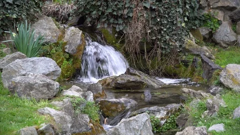 Flowing water stream, water drops and reflection Stock Footage 104979862