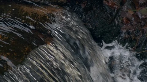 Flowing water stream, waterfall in the fall 4K 60P Slow motion Stock Footage 100529542