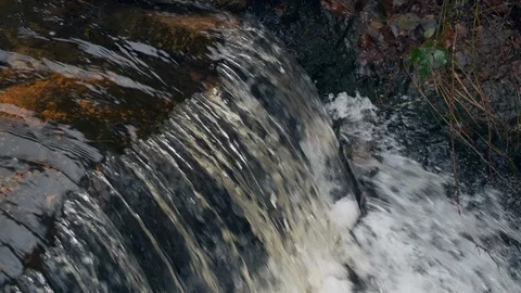 Flowing water stream, waterfall in the fall 4K 60P Slow motion Stock Footage 100529580