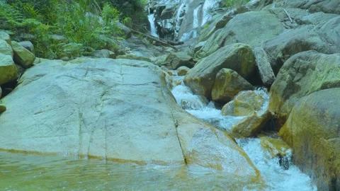 Flowing Waterfall and Rocky Stream | Tranquil Nature Scene with Cascading Waters Stock Footage 286933154