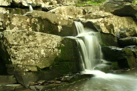 Flowing waterfall Stock Photos