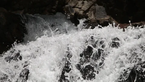 Flowing waters between rocks Stock Footage 105437557