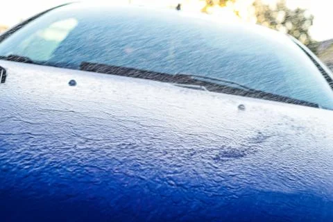 Flows down the hood of the car. Front light of sport car Stock Photos