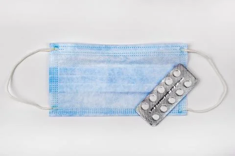 Flu Mask with a Pills Stock Photos