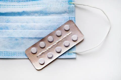 Flu Mask with a Pills Stock Photos
