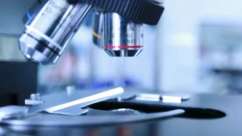 Flu virus under a microscope, part of a laboratory study of influenza, Stock Footage 336582856