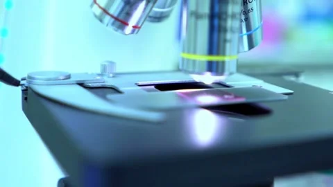 Flu virus under a microscope, part of a laboratory study of influenza, Stock Footage 336582918