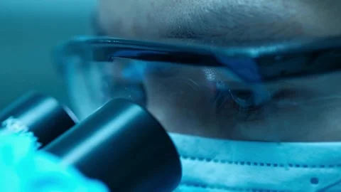 Flu virus under a microscope, part of a laboratory study of influenza, Stock Footage 336582937