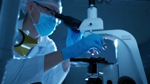Flu virus under a microscope, part of a laboratory study of influenza, Stock Footage 336582948