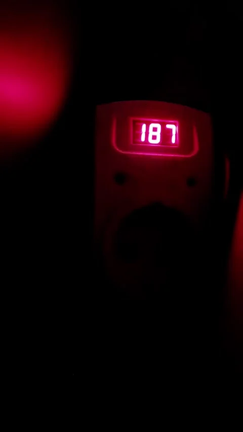 Fluctuating Red Numbers on Digital Voltmeter Display Stock-Footage 320427116