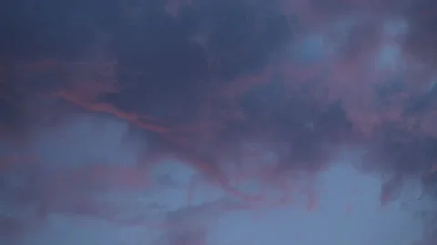 Fluffy Blue and Pink Clouds Flooding by After Sunset Stock Footage 132018315