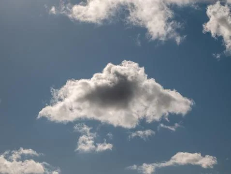 Fluffy Cloud Against Blue Sky 写真素材