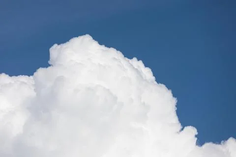 Fluffy cloud edge and blue sky Stock Photos