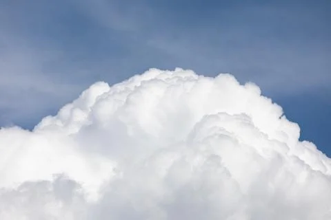 Fluffy cloud edge and blue sky Stock Photos