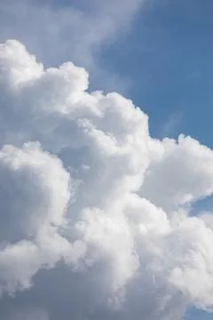 Fluffy cloud edge and blue sky Stock Photos
