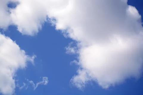 Fluffy cloud in a saturated blue sky.	14 Stock Photos