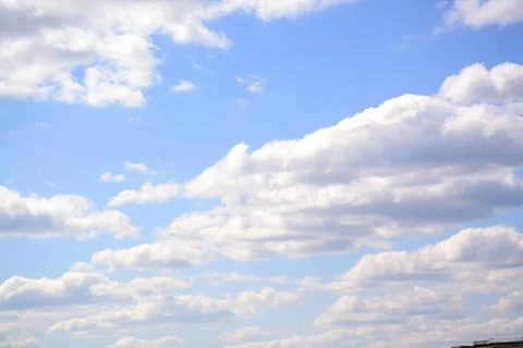 Fluffy cloud in a saturated blue sky.	12 Stock Photos